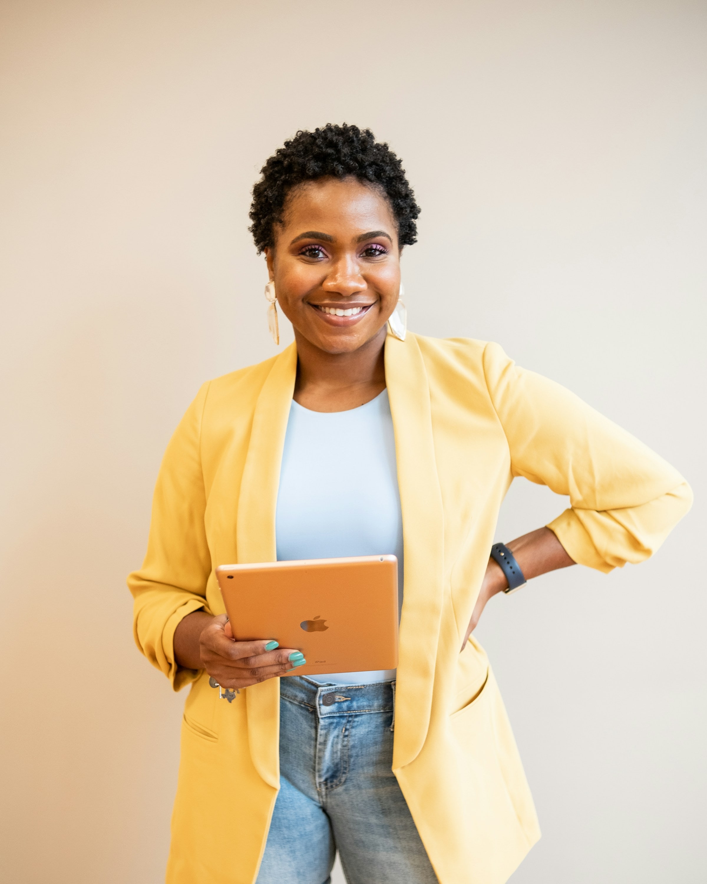 A smiling professional at work in a bright office